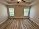 Spacious bedroom with wood flooring and a ceiling fan at 1259 Groveland Ln, Lakeland, FL 33811