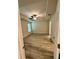Bedroom with tray ceiling, ceiling fan, two windows, and wood floors at 1259 Groveland Ln, Lakeland, FL 33811