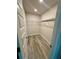 Walk-in closet with modern flooring and ample shelving at 1259 Groveland Ln, Lakeland, FL 33811