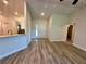 Open-concept living room with entrance and kitchen area at 1259 Groveland Ln, Lakeland, FL 33811