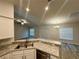 Open-concept living room with kitchen featuring granite countertops at 1259 Groveland Ln, Lakeland, FL 33811