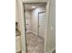Walk-in pantry with tiled floors, shelving, and white painted door at 1259 Groveland Ln, Lakeland, FL 33811