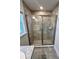 Modern bathroom shower with glass enclosure and tile surround at 1259 Groveland Ln, Lakeland, FL 33811