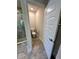 En suite bathroom with toilet and tiled shower with glass door at 1265 Groveland Ln, Lakeland, FL 33811