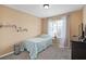 Bright bedroom with a comfortable twin bed, neutral walls, and plenty of natural light coming through the window at 2417 Passamonte Dr # 1E, Winter Park, FL 32792