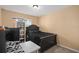 Cozy bedroom featuring a black bed frame, soft carpet, and a shelf, perfect for relaxation and rest at 2417 Passamonte Dr # 1E, Winter Park, FL 32792
