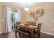 Charming dining room with stylish decor and a window, perfect for Gathering meals and gatherings at 2417 Passamonte Dr # 1E, Winter Park, FL 32792