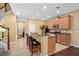 Well-equipped kitchen with granite counters, breakfast bar, and stainless steel appliances, ideal for cooking at 2417 Passamonte Dr # 1E, Winter Park, FL 32792