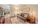 Inviting living room with a comfortable sofa, stylish decor, and warm lighting, perfect for relaxation at 2417 Passamonte Dr # 1E, Winter Park, FL 32792