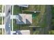 Aerial view of a home showcasing a well-manicured backyard, fenced perimeter, and lush greenery at 5189 Greenheart Ave, Mount Dora, FL 32757