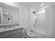 Bathroom with a tub and shower combination and granite vanity at 5189 Greenheart Ave, Mount Dora, FL 32757