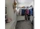 Walk-in closet with organized shelving and plenty of storage space for clothes and shoes at 5189 Greenheart Ave, Mount Dora, FL 32757