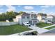 Two-story home with a well-manicured lawn, attached garage, and a long driveway for ample parking at 5189 Greenheart Ave, Mount Dora, FL 32757