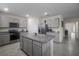 Spacious kitchen with a large center island, modern appliances, and ample cabinet space for storage at 5189 Greenheart Ave, Mount Dora, FL 32757