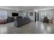 Comfortable living room featuring tile floors, large windows, and an open concept floorplan at 5189 Greenheart Ave, Mount Dora, FL 32757