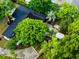 Aerial view of a home with a new roof surrounded by lush greenery at 808 S Clara Ave, Deland, FL 32720
