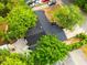 Aerial view of a home with a new roof and surrounding trees at 808 S Clara Ave, Deland, FL 32720