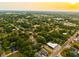 Aerial view showcases the neighborhood's lush landscaping and residential streets at 808 S Clara Ave, Deland, FL 32720