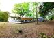 Exterior of house from back yard with car port and shed at 808 S Clara Ave, Deland, FL 32720