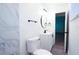 Well-lit bathroom features modern vanity, black fixtures, and shower with marble tile at 808 S Clara Ave, Deland, FL 32720