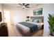 Cozy bedroom with ceiling fan, modern decor, and ensuite bathroom entrance at 808 S Clara Ave, Deland, FL 32720