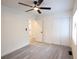 Bedroom with neutral paint, ceiling fan and wood look flooring at 808 S Clara Ave, Deland, FL 32720
