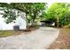 View of house from driveway showing car port and shed at 808 S Clara Ave, Deland, FL 32720