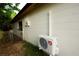 Exterior view of a home with a mini-split air conditioner unit at 808 S Clara Ave, Deland, FL 32720