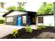 Unique home featuring rock accents, a bright blue front door, and a freshly landscaped yard at 808 S Clara Ave, Deland, FL 32720