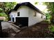 Rear exterior of home showing new paint and landscaping at 808 S Clara Ave, Deland, FL 32720