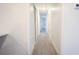 Hallway with sleek floors and neutral wall color; leads to bedrooms and bathrooms at 808 S Clara Ave, Deland, FL 32720