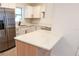 Bright kitchen featuring white cabinets, stainless steel appliances, and a stylish countertop at 808 S Clara Ave, Deland, FL 32720