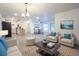 Spacious open floor plan with modern lighting and stylish decor offers a welcoming atmosphere at 808 S Clara Ave, Deland, FL 32720