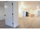 Open-concept home featuring light, hard surface floors, and a view into the kitchen and dining areas at 808 S Clara Ave, Deland, FL 32720