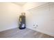 Utility room with water heater, shelving, window, and hookups at 808 S Clara Ave, Deland, FL 32720