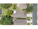 An aerial view showcases the home's roof, landscaping, and proximity to the street and neighboring houses at 1309 Timberbend Cir, Orlando, FL 32824