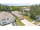 Aerial view of a well-maintained single-story home with an attached garage, driveway, and a neatly kept lawn at 1309 Timberbend Cir, Orlando, FL 32824