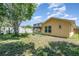 Backyard with a lawn and exterior of a home and a screened in porch at 1309 Timberbend Cir, Orlando, FL 32824