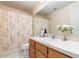 Traditional bathroom featuring tile flooring, wooden cabinets, and a floral-patterned shower curtain at 1309 Timberbend Cir, Orlando, FL 32824