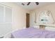 This bedroom features a ceiling fan and a vanity with a unique mirror design at 1309 Timberbend Cir, Orlando, FL 32824