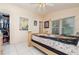 Cozy bedroom showcasing tile floors, neutral walls, and an inviting ambiance perfect for restful nights at 1309 Timberbend Cir, Orlando, FL 32824