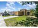 Charming one-story home featuring an attached garage and inviting front entrance with a well-maintained lawn at 1309 Timberbend Cir, Orlando, FL 32824