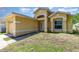 Charming one-story home featuring an attached garage and inviting front entrance with a well-maintained lawn at 1309 Timberbend Cir, Orlando, FL 32824