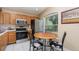 Well-equipped kitchen with stainless steel appliances, ample counter space, and a cozy breakfast nook at 1309 Timberbend Cir, Orlando, FL 32824