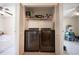 Modern laundry closet with a wire rack and two appliances for efficiency at 1309 Timberbend Cir, Orlando, FL 32824
