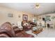 Cozy living room and dining room featuring tile floors, ceiling fan, and natural light at 1309 Timberbend Cir, Orlando, FL 32824