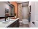 Well-lit bathroom features a shower-tub combo with modern fixtures and stylish decor at 17020 Cercis Loop, Clermont, FL 34711