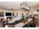 Open-concept living and dining area, seamlessly blending comfort and style with modern decor and ample natural light at 17020 Cercis Loop, Clermont, FL 34711
