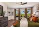 Serene main bedroom features a plush bed, hardwood floors, and a picturesque view at 17020 Cercis Loop, Clermont, FL 34711
