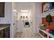 Spacious mud room offers convenience with laundry facilities, storage, and stylish decor at 17020 Cercis Loop, Clermont, FL 34711